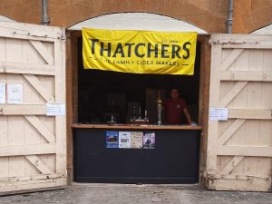 outdoor-bar-stanton-club-at-stanway-fete-2024-with-russ-behind-bar